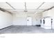 Spacious garage with ample storage cabinets, laundry machines and refrigerator at 5400 Tassara Way # 106, Las Vegas, NV 89108
