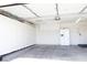 Well-organized garage with ample storage, including cabinets and refrigerator at 5400 Tassara Way # 106, Las Vegas, NV 89108