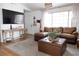 Cozy living room with a large sofa, decorative throw, and a view of the entryway at 5400 Tassara Way # 106, Las Vegas, NV 89108