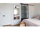 Comfortable bedroom with decorative sliding glass door and built in mirror at 5400 Tassara Way # 106, Las Vegas, NV 89108
