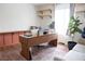 Bright office with a large desk, comfortable seating, and natural light at 5400 Tassara Way # 106, Las Vegas, NV 89108