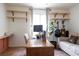 Office featuring a desk, wall shelves, and comfortable seating at 5400 Tassara Way # 106, Las Vegas, NV 89108