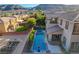 Aerial view of the property featuring a private pool, spa, and lush backyard in a quiet neighborhood at 5434 Fawn Chase Way, Las Vegas, NV 89135