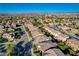 Community features well-maintained homes and landscaping with a view of the mountains on the horizon at 5434 Fawn Chase Way, Las Vegas, NV 89135