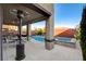 Outdoor patio features a stainless grill, a dining table, and a beautiful private pool at 5434 Fawn Chase Way, Las Vegas, NV 89135