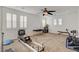 Spacious bonus room flooded with natural light with a ceiling fan and neutral carpet at 5434 Fawn Chase Way, Las Vegas, NV 89135