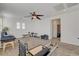 Spacious bonus room with carpet flooring, ceiling fan, and gym equipment for a home fitness area at 5434 Fawn Chase Way, Las Vegas, NV 89135