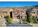 Well-manicured two-story home features a covered porch, landscaped yard and attached two-car garage at 5434 Fawn Chase Way, Las Vegas, NV 89135