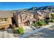 Beautiful home exterior featuring desert landscaping and mountain views at 5434 Fawn Chase Way, Las Vegas, NV 89135