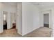 Hallway between bedrooms with carpet flooring and neutral paint, leading to bedrooms and staircase at 5434 Fawn Chase Way, Las Vegas, NV 89135