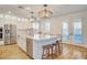 Spacious kitchen with a large island, stainless steel appliances, and access to the outdoor patio at 5434 Fawn Chase Way, Las Vegas, NV 89135