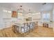 Bright, modern kitchen features a large island with seating, stainless steel appliances, and ample cabinet space at 5434 Fawn Chase Way, Las Vegas, NV 89135