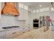 Modern kitchen features stone countertops, stainless steel appliances, and custom cabinetry with hardware at 5434 Fawn Chase Way, Las Vegas, NV 89135