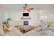 Inviting living room featuring a fireplace, wood floors and modern decor at 5434 Fawn Chase Way, Las Vegas, NV 89135
