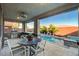 Covered patio area with built-in grill, dining table, and view of the pool at 5434 Fawn Chase Way, Las Vegas, NV 89135