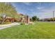 Well-manicured community park featuring a picnic area, trees, and green space for relaxation and recreation at 5434 Fawn Chase Way, Las Vegas, NV 89135