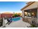 Outdoor pool area featuring a stone bar, seating, and lush landscaping creating a relaxing retreat at 5434 Fawn Chase Way, Las Vegas, NV 89135