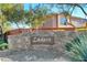 Community entrance displaying the 'Ladera' sign, complemented by desert landscaping and lush greenery at 5434 Fawn Chase Way, Las Vegas, NV 89135