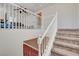 Well-lit staircase with carpeted steps and white railing leading to the upper level at 5434 Fawn Chase Way, Las Vegas, NV 89135