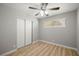 Bedroom with light-colored floor, base molding and window at 5817 Glen Eagles Ln, Las Vegas, NV 89108