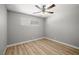 Bright bedroom with light-colored floors and a ceiling fan at 5817 Glen Eagles Ln, Las Vegas, NV 89108
