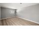 Bedroom with light-colored floor, base molding and window at 5817 Glen Eagles Ln, Las Vegas, NV 89108