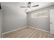 Cozy bedroom with light-colored floors, ceiling fan, and window at 5817 Glen Eagles Ln, Las Vegas, NV 89108
