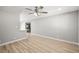 Spacious living room with light-colored floors and modern lighting at 5817 Glen Eagles Ln, Las Vegas, NV 89108