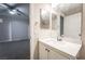 Bright bathroom with white vanity and decorative mirror at 5855 Valley Dr # 2161, North Las Vegas, NV 89031