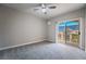 Bright bedroom with carpet flooring and access to a private outdoor deck at 5855 Valley Dr # 2161, North Las Vegas, NV 89031