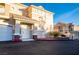 Exterior of a well-maintained two-story home with attached garages and manicured landscaping at 5855 Valley Dr # 2161, North Las Vegas, NV 89031