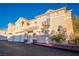 Attractive two-story home with a red-tiled roof and ample parking spaces at 5855 Valley Dr # 2161, North Las Vegas, NV 89031