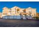 A well-maintained two-story home features a red-tiled roof and multiple garage spaces at 5855 Valley Dr # 2161, North Las Vegas, NV 89031