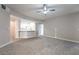 Open-concept living and kitchen area with recessed lighting, neutral color palette, and ceiling fan at 5855 Valley Dr # 2161, North Las Vegas, NV 89031