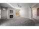 Bright living room with gray carpet, fireplace, ceiling fan, and lots of natural light at 5855 Valley Dr # 2161, North Las Vegas, NV 89031