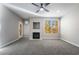 Spacious living room features recessed lighting, a ceiling fan, and a decorative fireplace at 5855 Valley Dr # 2161, North Las Vegas, NV 89031