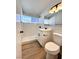 Stylish bathroom with modern vanity, updated fixtures, and sleek walk-in shower at 6261 Rassler Ave, Las Vegas, NV 89107
