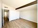 Spacious bedroom with beam, large closet, and durable wood-look flooring at 6261 Rassler Ave, Las Vegas, NV 89107