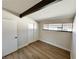 Small bedroom with beam, standard closet, and durable wood-look flooring at 6261 Rassler Ave, Las Vegas, NV 89107