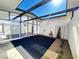 Courtyard with tiled surface, garden area, fountain, and modern glass windows at 6261 Rassler Ave, Las Vegas, NV 89107