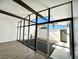 A bright courtyard with a fountain, open roof, and floor to ceiling glass windows at 6261 Rassler Ave, Las Vegas, NV 89107