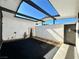 Exterior courtyard with patio area, fountain, gravel landscaping, and shaded roof at 6261 Rassler Ave, Las Vegas, NV 89107