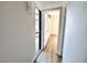 Bright hallway with modern lighting, fresh paint, and durable wood-look flooring at 6261 Rassler Ave, Las Vegas, NV 89107