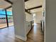 Modern kitchen with stainless steel appliances, ample counter space, stylish cabinets, and wood-look flooring at 6261 Rassler Ave, Las Vegas, NV 89107