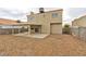Spacious backyard with gravel, block wall, and covered patio, perfect for outdoor gatherings at 6388 Canyon Dawn Ave, Las Vegas, NV 89108