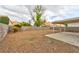 Backyard with rock landscaping, privacy walls, and a covered patio for relaxing and entertaining at 6388 Canyon Dawn Ave, Las Vegas, NV 89108