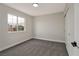 Cozy bedroom with gray carpet, a window with neighborhood views, and a closet at 6388 Canyon Dawn Ave, Las Vegas, NV 89108