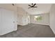 Spacious bedroom features gray carpet, ceiling fan, neutral walls, and a window offering natural light at 6388 Canyon Dawn Ave, Las Vegas, NV 89108