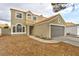 Two-story home featuring a neutral stucco exterior, tile roof, and an attached two-car garage at 6388 Canyon Dawn Ave, Las Vegas, NV 89108