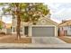 Residential home featuring desert landscaping, and a two car garage with a tile roof at 6388 Canyon Dawn Ave, Las Vegas, NV 89108
